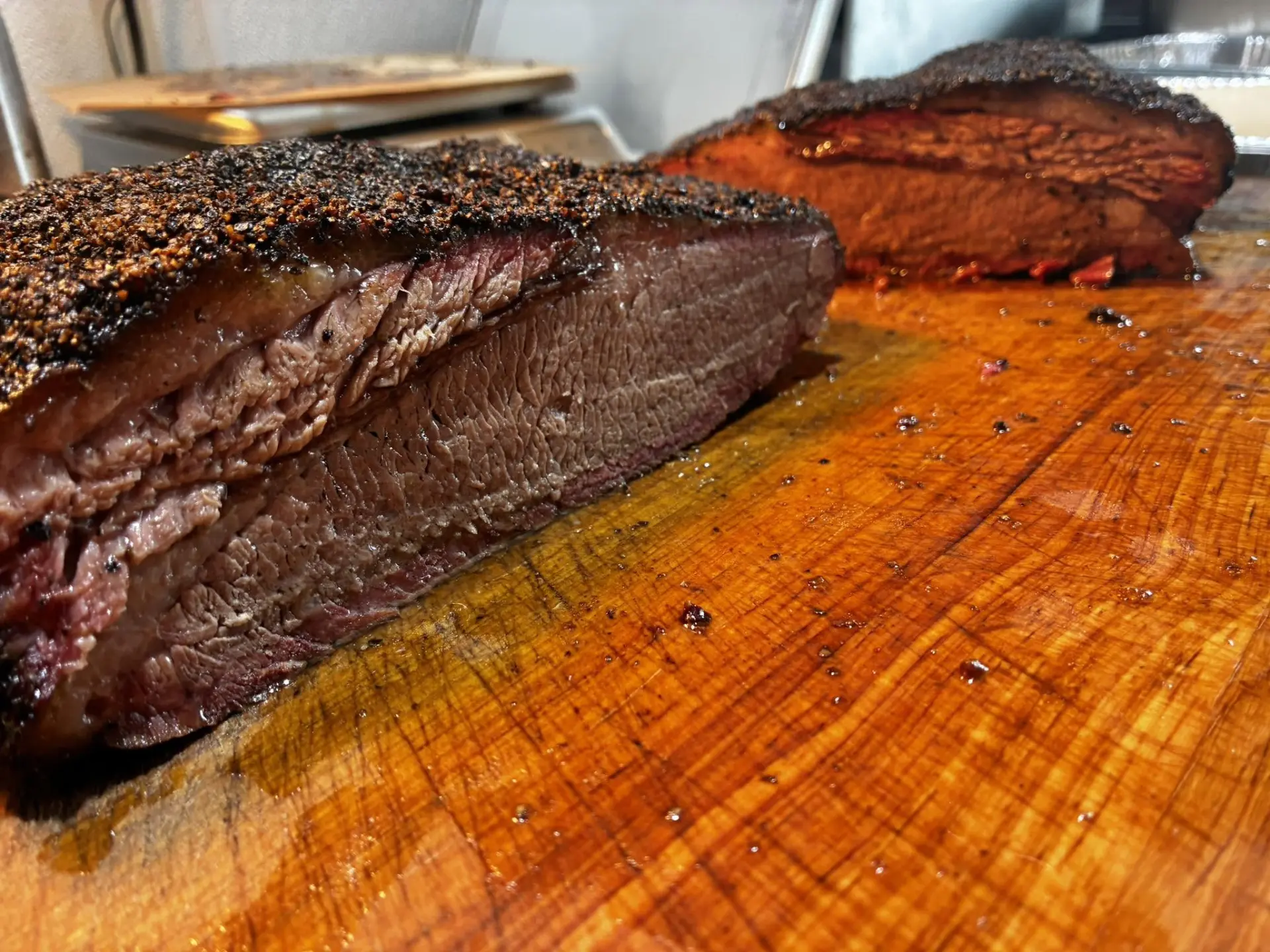 Sliced brisket on the butcher block Close-up of a sliced PIT14 brisket on a butcher block