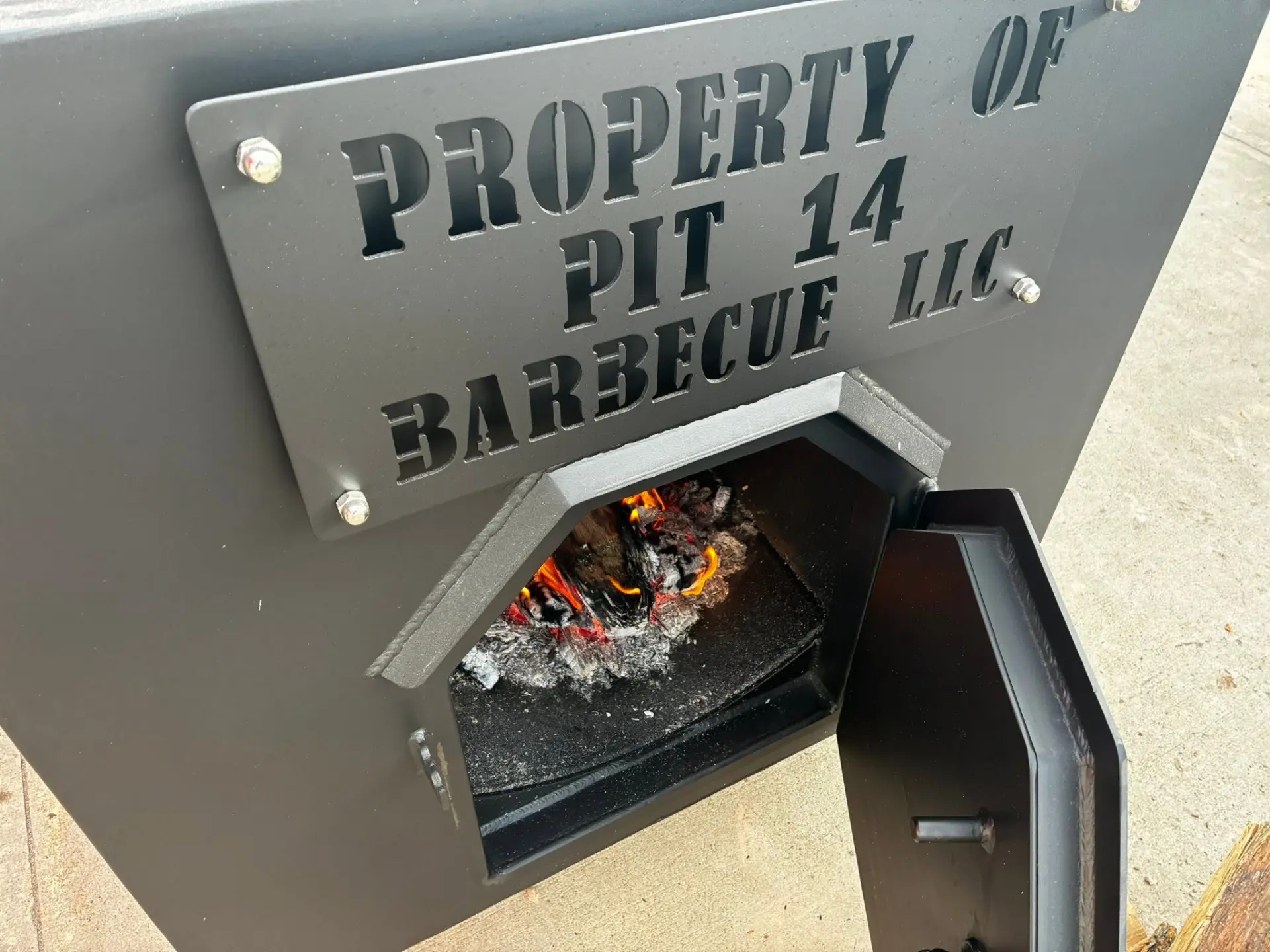 Real wood fire in the PIT14 offset smoker Fire burning in the firebox of the PIT14 Barbecue offset smoker in Spearfish, SD
