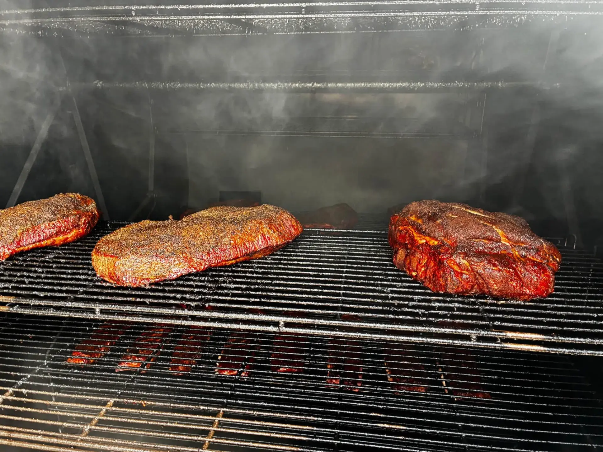 BBQ catering in Spearfish, SD — briskets on the offset smoker Briskets and pork butts smoking inside the PIT14 offset smoker for a catering order